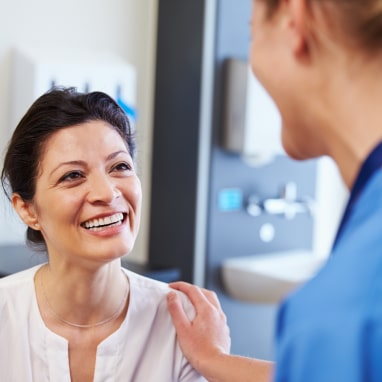 Woman talking to nurse