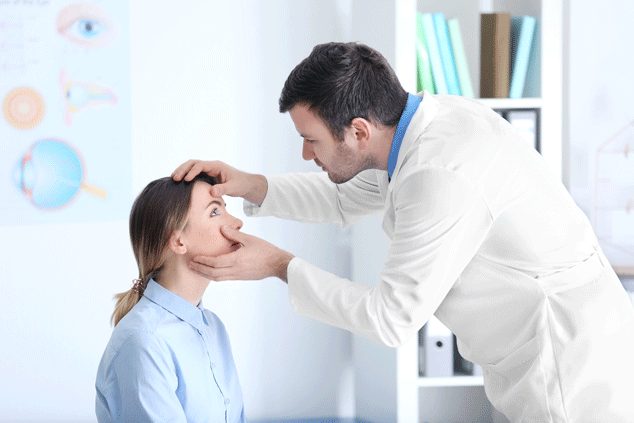 Doctor checking patient's eyes