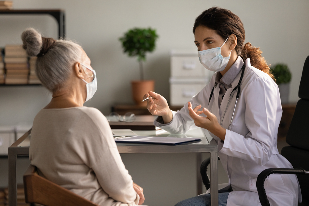 Doctor with an older female patient