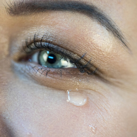 Woman's eye and tear drop