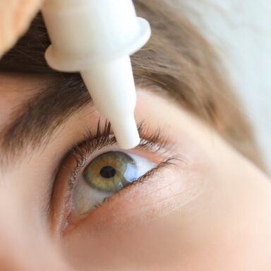 Man applying eye drops