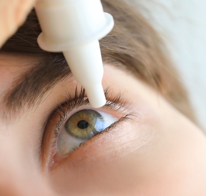 Man applying eye drops